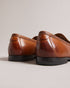 ADLERRC-Shoes-Step into timeless elegance with our ADLERRC loafers. Crafted from premium leather, they feature a sleek almond toe design that adds a touch of sophistication to any ensemble. Whether you're dressing up for a formal occasion or adding a touch of refinement to your everyday look, they're the perfect choice for the modern gentleman who appreciates classic style with a contemporary twist. Saddle loafers Leather upper Almond toe Slip on Resin sole Debossed stripe details- Ted Baker Romania
